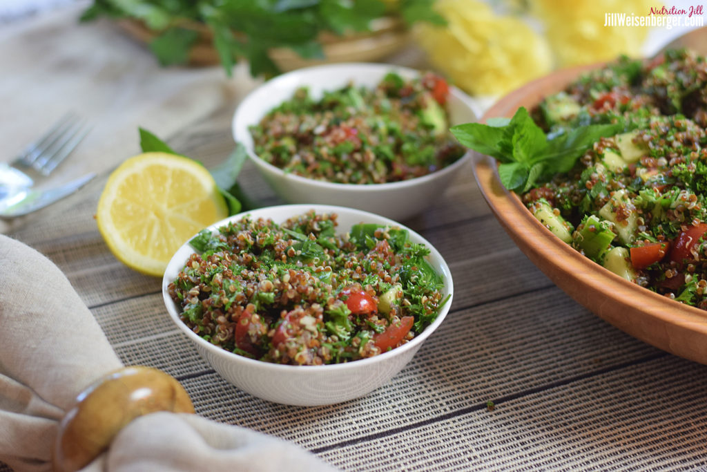healthy quinoa tabouli salad in white bowls