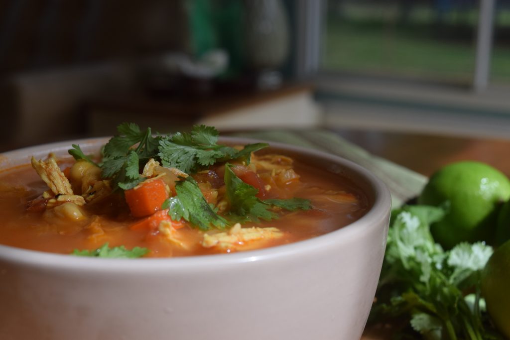 Cilantro - a healthy herb over curried chicken and chickpea stew