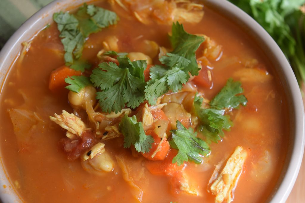 This Curried Chicken and Chickpea Stew is an easy and satisfying recipe, that is perfect for make-ahead dinners or healthy freezer meals | @JWeisenberger #NutritionJill #EasyChickpeaStew #HealthyFreezerMeals Overhead Closeup of Curried Chicken and Chickpea Stew