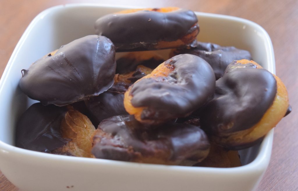 healthier chocolate-dipped apricots in bowl