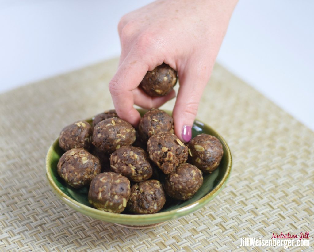 chocolate peanut butter balls grabbed in bowl
