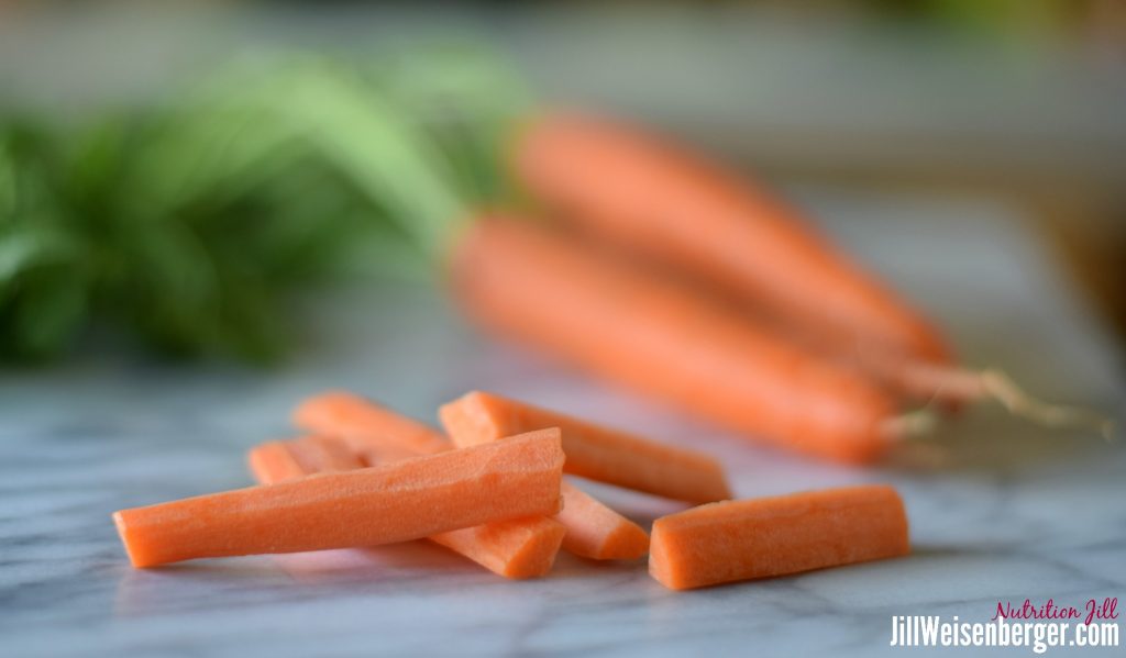 preparing vegetables for roasted carrots