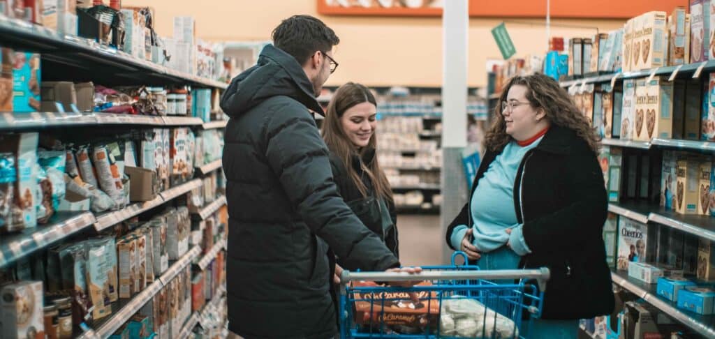 3 people buying groceries
