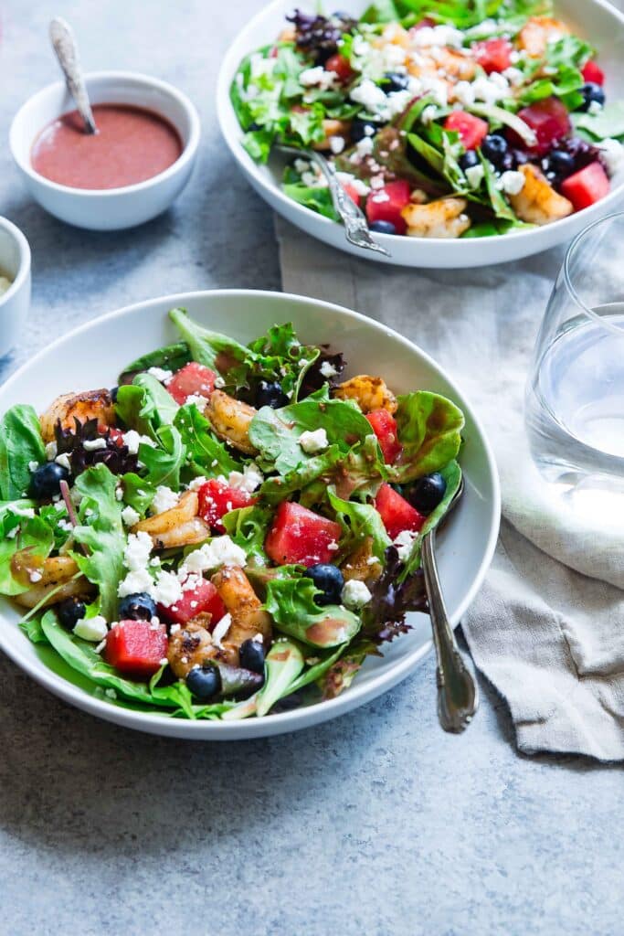 healthy salads in blue bowls for cancer prevention