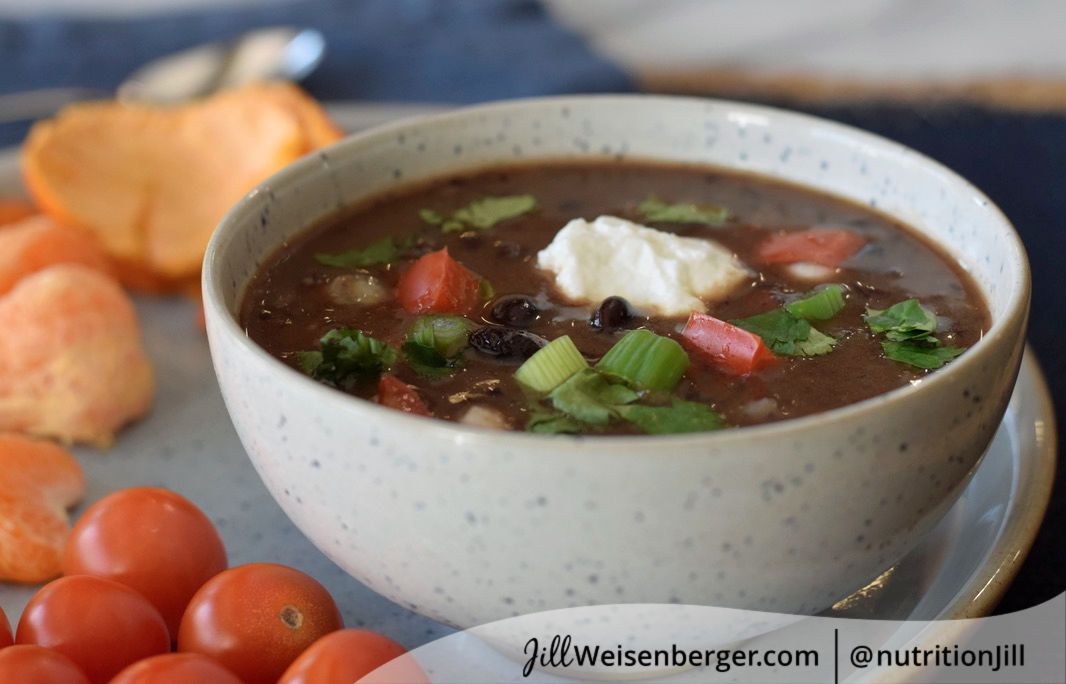 Vegetarian black bean soup served with fruits and vegetables