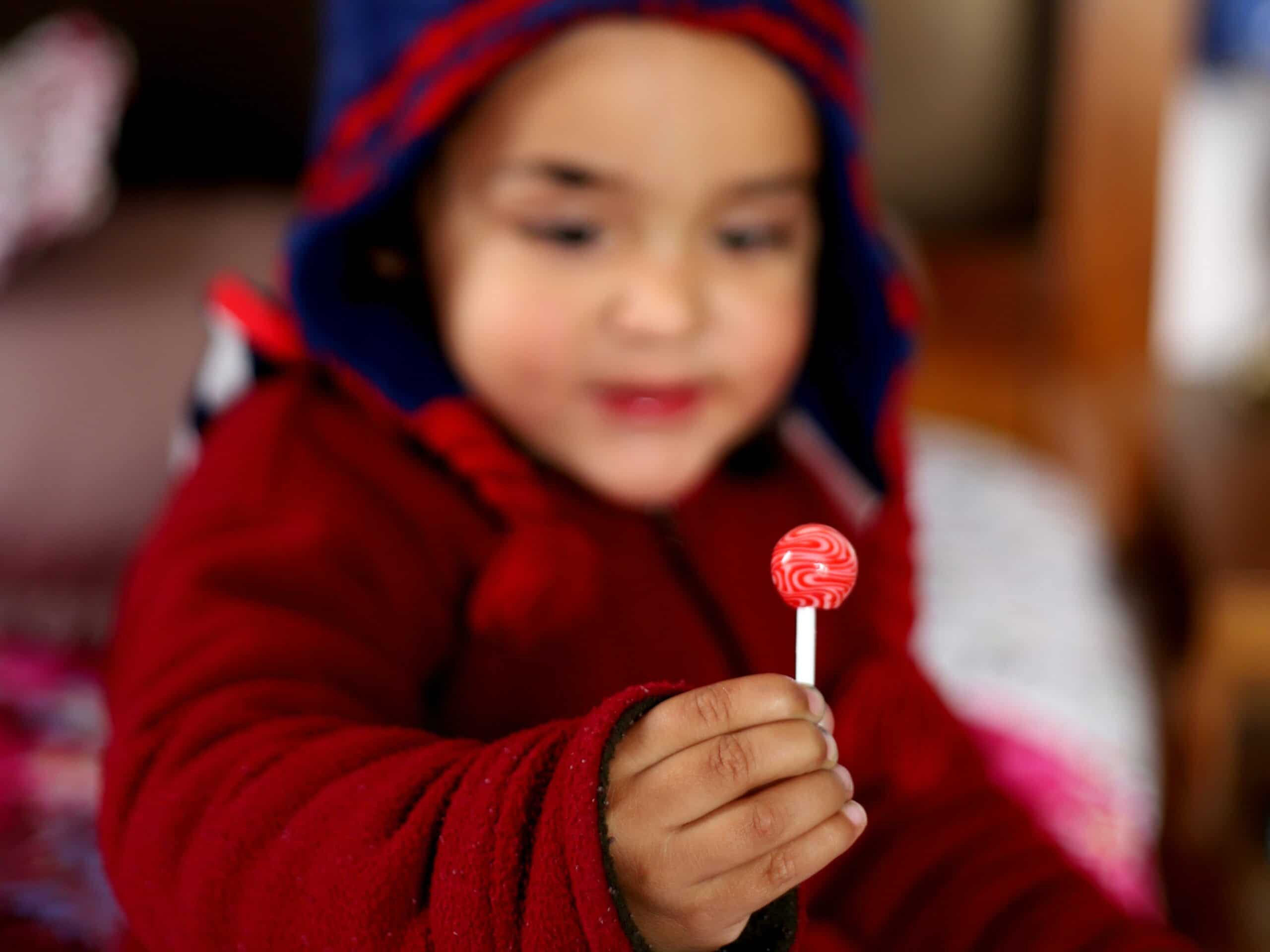 boy with a red lollipop